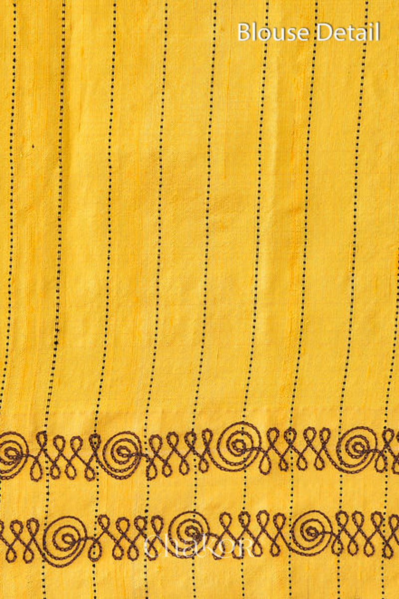 Close up of Blouse of Peach Yellow Raw Tussar silk handloom saree with Yellow border and detailed with aari embroidery.