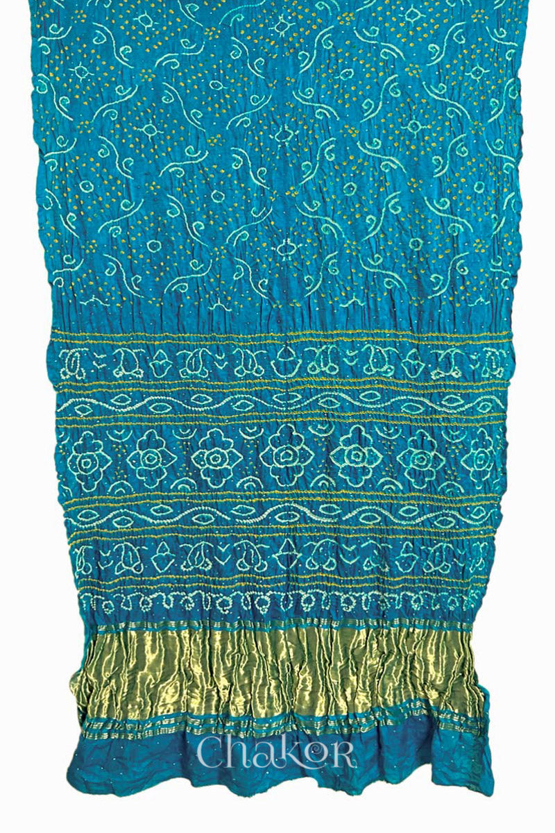 Full view of Peacock Blue Bandhani Gaji Silk Saree, handcrafted with rai bandhej patterns and mukaish embroidery.