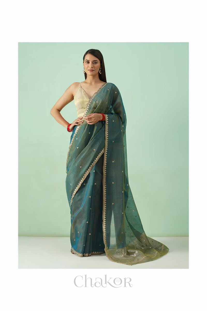Model wearing Teal Blue Chanderi silk cotton saree in a full-length promotional shot.
