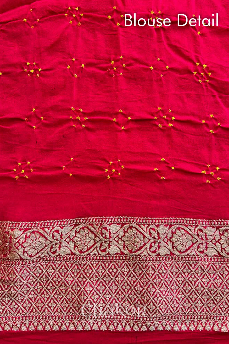 Close up of Handcrafted Red Bandhani Banarasi Georgette Saree in pure silk featuring zari weaving and Kutch Bandhej with mirror embroidery, Perfect for wedding and occasions.