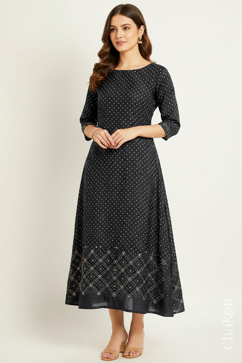 Black mulberry silk Bandhani (Rai Bandhej) dress stitched from the fabric, featuring all-over white and yellow butis and a geometric mirror-work hem border – CHAKOR