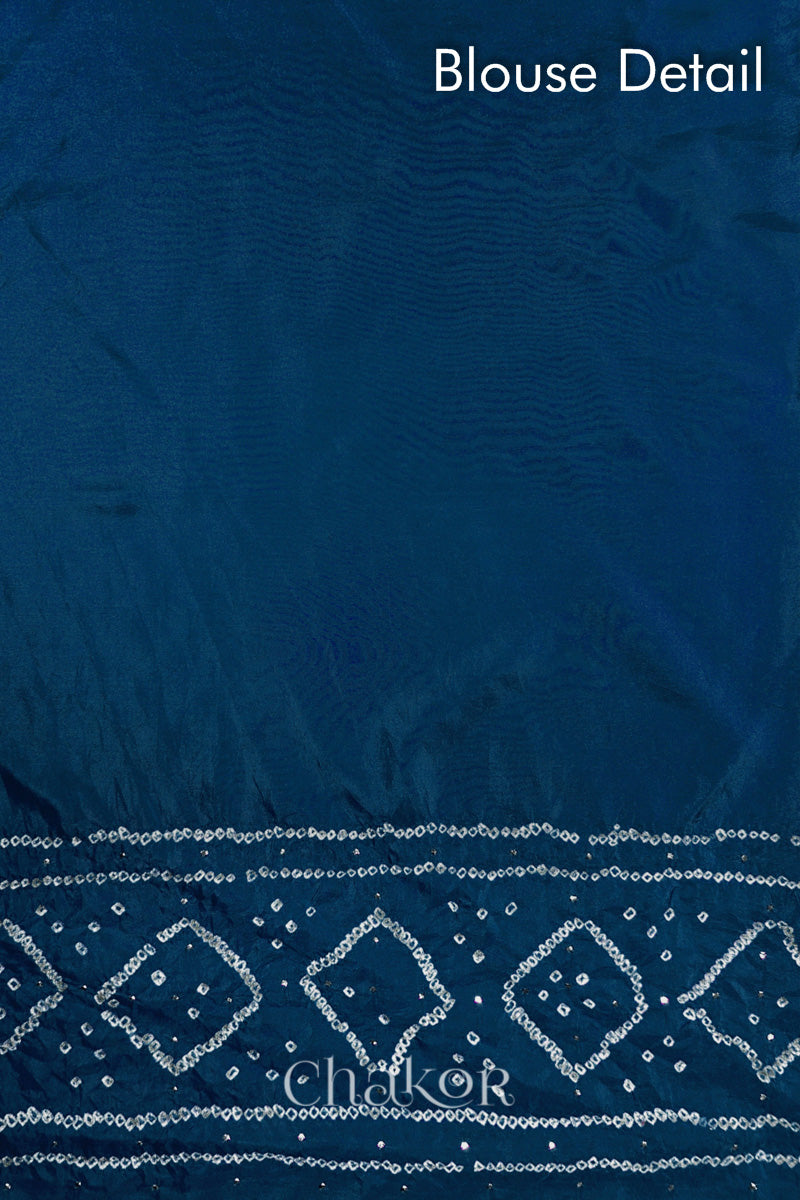 Blouse detail of indigo blue Bandhani Mulberry Silk Saree, handcrafted in rai bandhej patterns with mukaish embroidery.