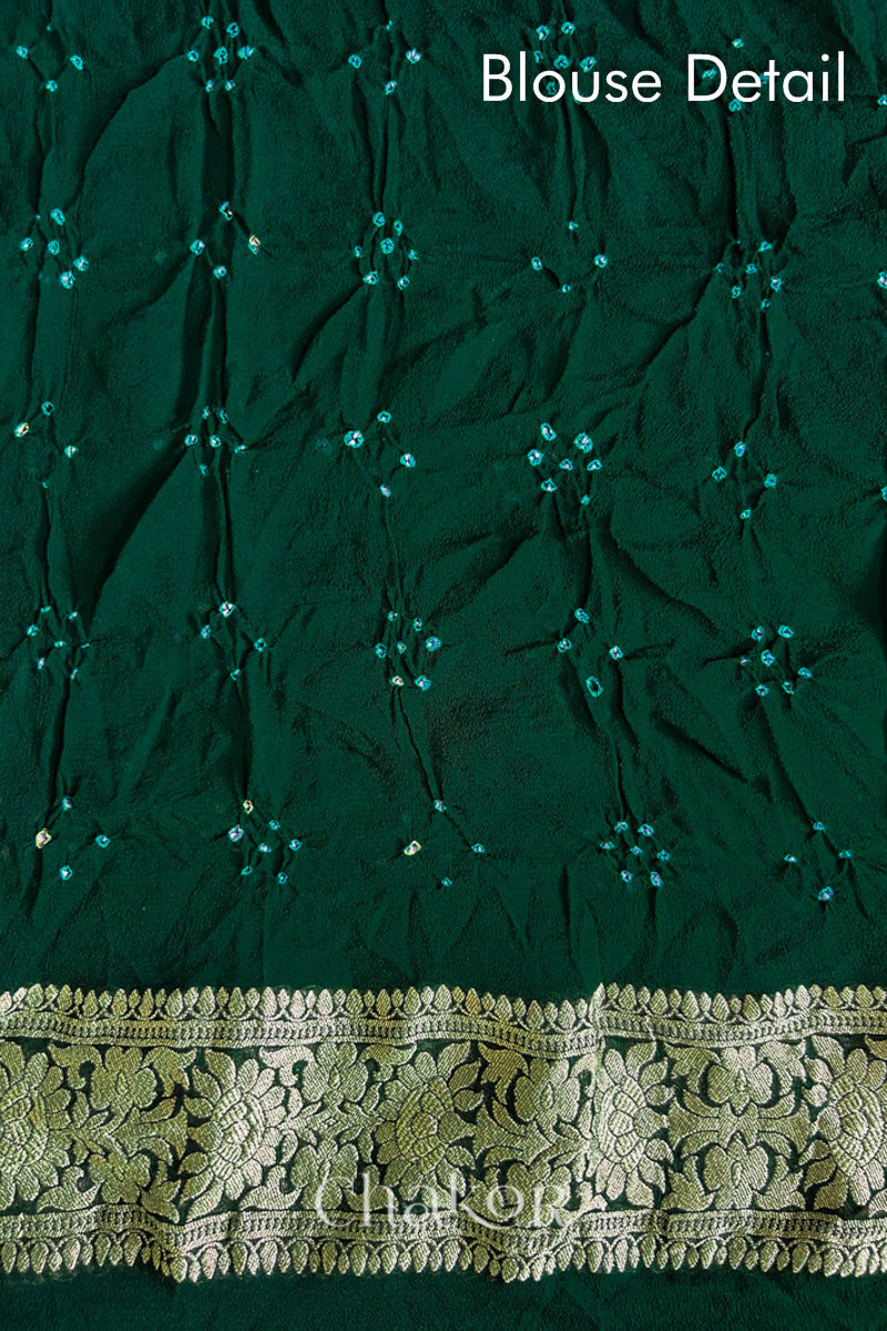 Close up of Handcrafted Green Bandhani Banarasi Georgette Saree in pure silk featuring zari weaving and Kutch Bandhej for weddings and occasions.