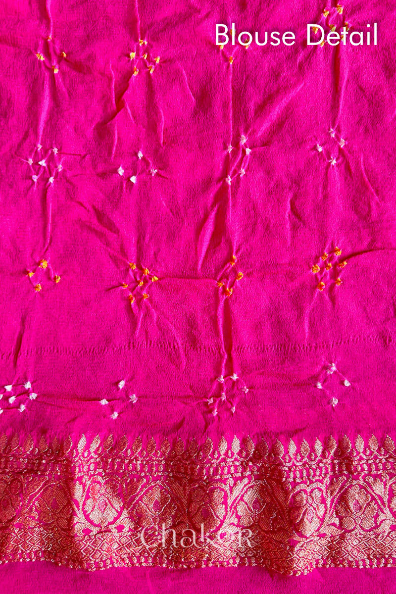 Close up of Handcrafted Pink and grey ombre shaded Bandhani Banarasi Georgette Silk Saree featuring zari weaving and Kutch Bandhej.
