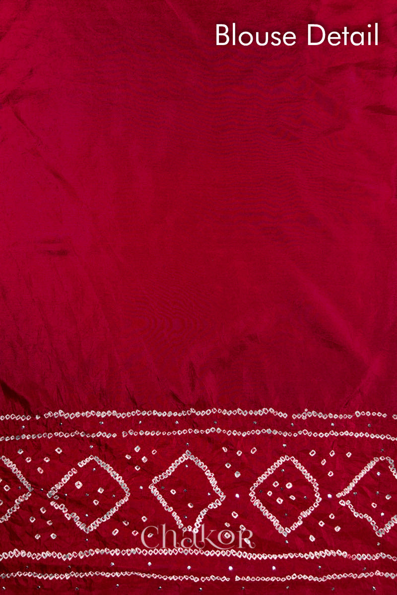 Blouse detail of Red Bandhani Mulberry Silk Saree, handcrafted in rai bandhej patterns with mukaish embroidery.