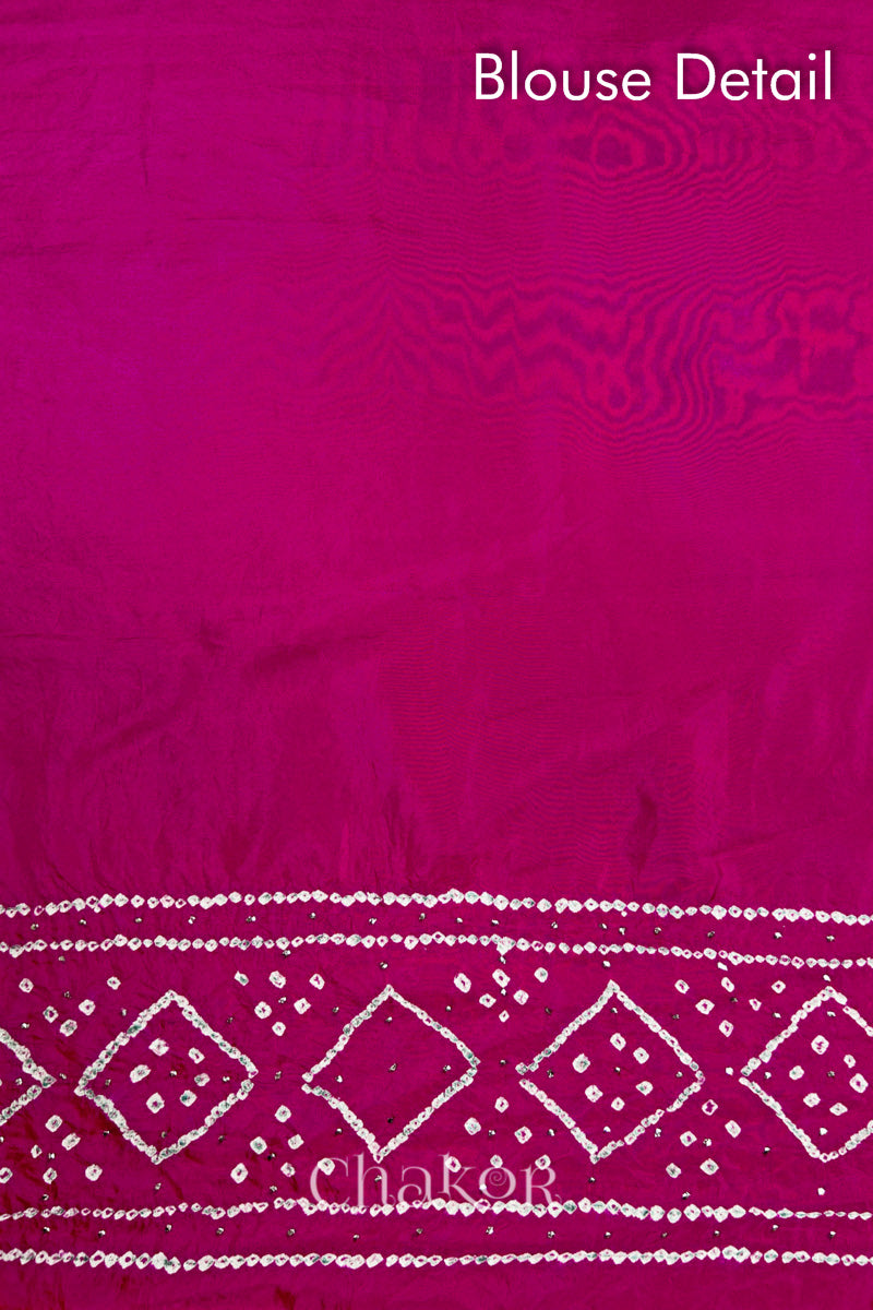 Blouse detail of Rani pink Bandhani Mulberry Silk Saree, handcrafted in rai bandhej patterns with mukaish embroidery.