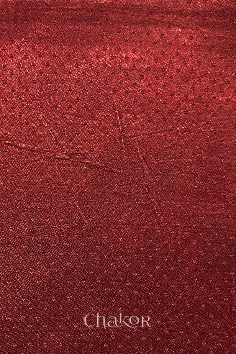 brick red mashru self textured fabric with 'Chakor' logo visible.