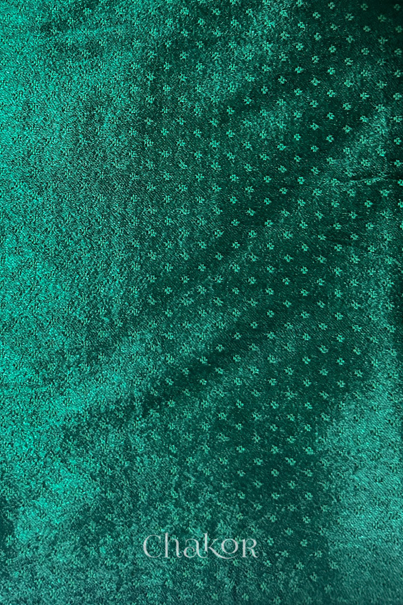dark green mashru self textured fabric with 'Chakor' logo visible.