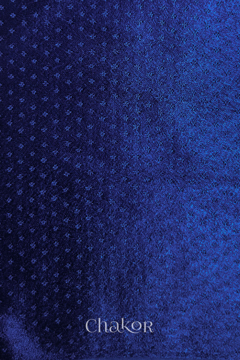 Royal blue mashru self textured fabric with 'Chakor' logo visible.