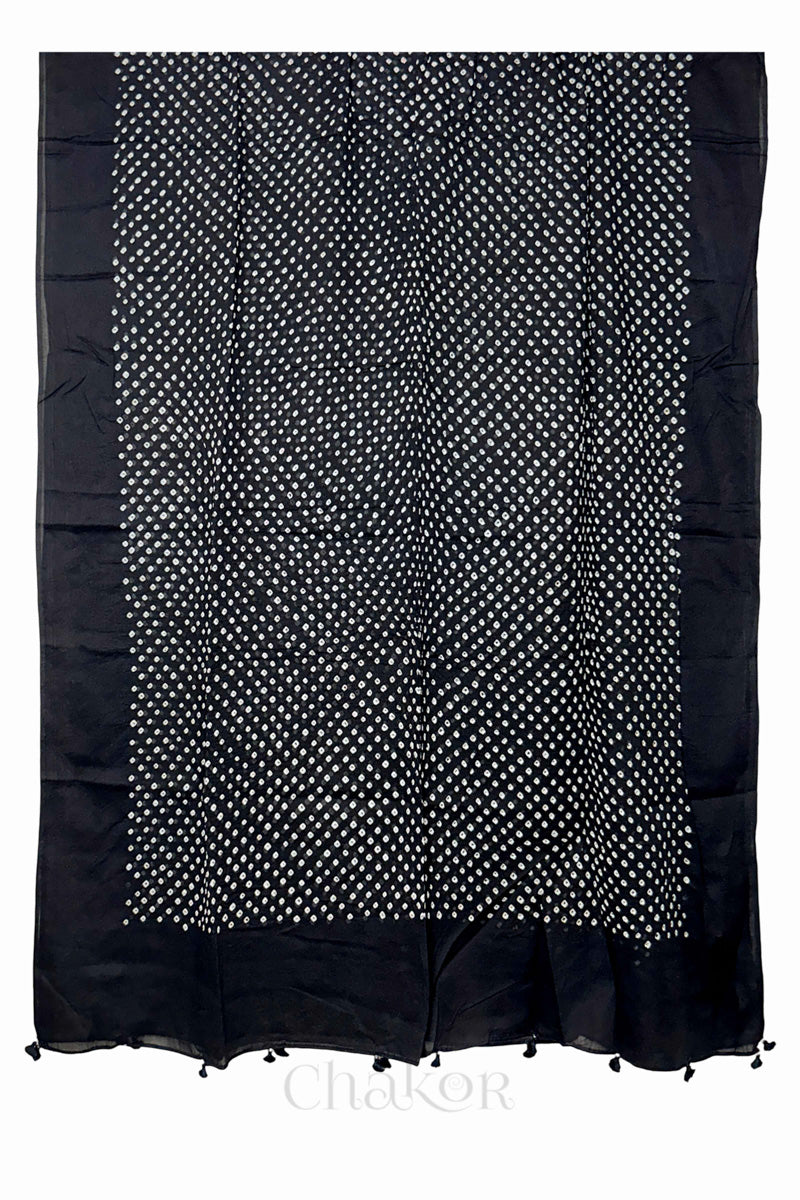 Chakor's black cotton mul mul dupatta with white bandhani pattern, edged with tassels at the edge.
