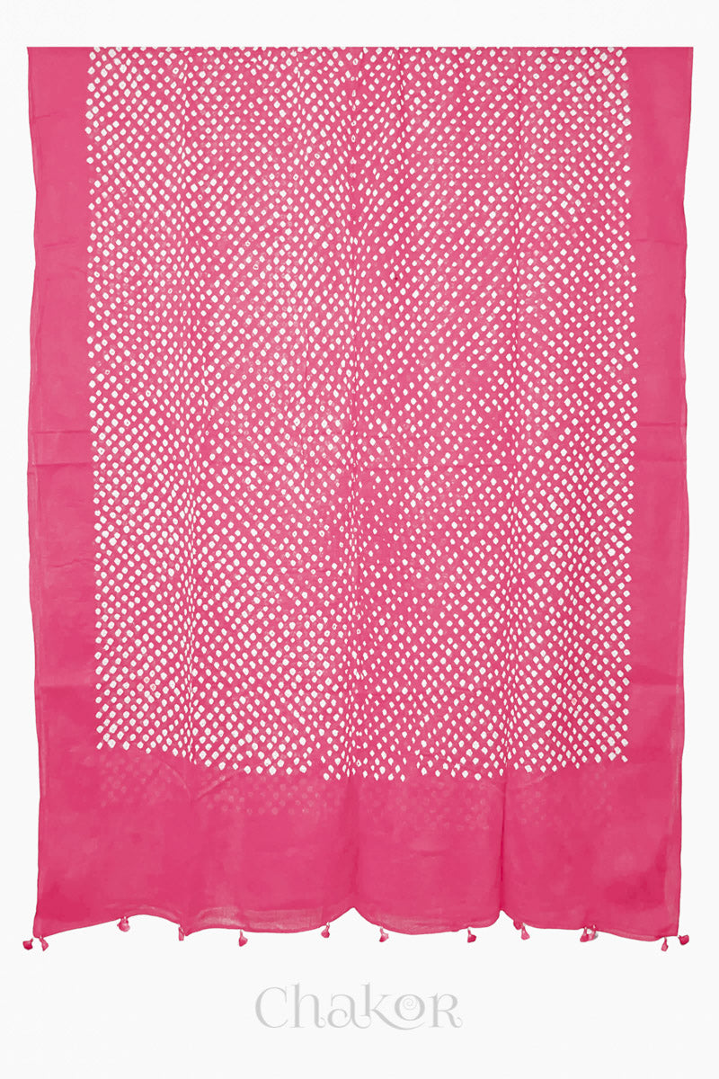 Chakor's pink cotton mul mul dupatta with white bandhani pattern, edged with tassels at the end.