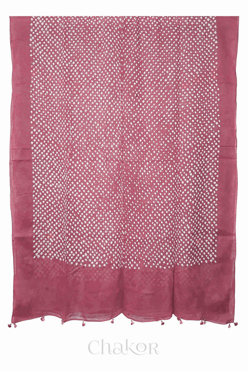 Chakor's old rose cotton mul mul dupatta with white bandhani pattern, edged with tassels at the end.