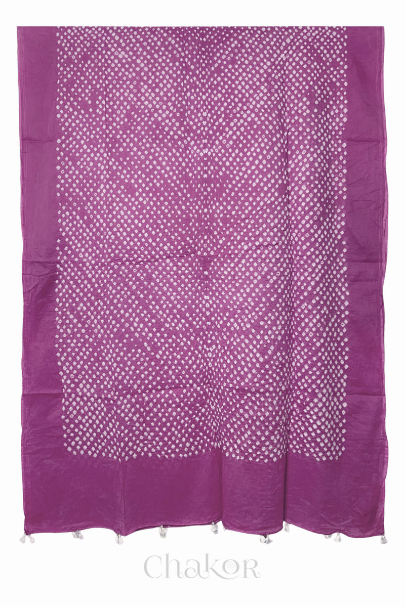Chakor's violet cotton mul mul dupatta with white bandhani pattern, edged with tassels at the end.