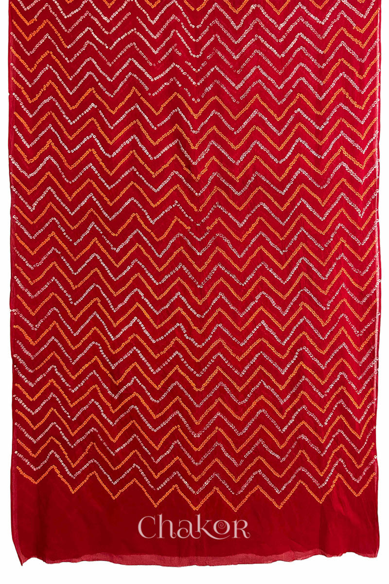 Full view of Red Bandhani Mul Cotton Saree with zigzag patterns in yellow and white bandhej dots.