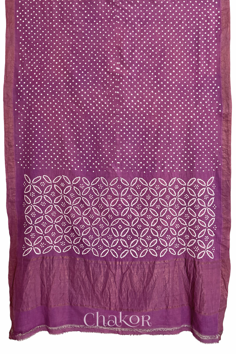 Purple saree, flat draped with Rai Bandhej traditional design against white background and 'Chakor' watermark.