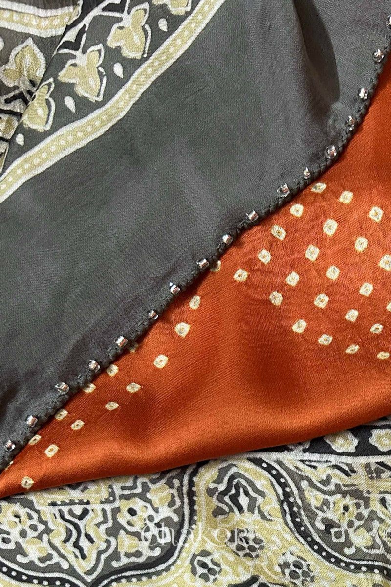 Orange Bandhani and Taupe Beige Ajrakh combination modal stole with glass bead edging detail on pallu end.
