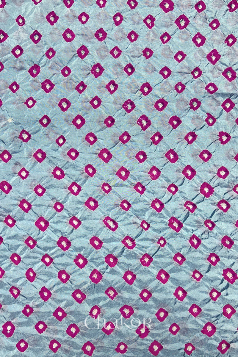 Sky Blue Mulberry silk fabric showcasing dual colour Pink bandhani patterns and Chakor brand watermark.