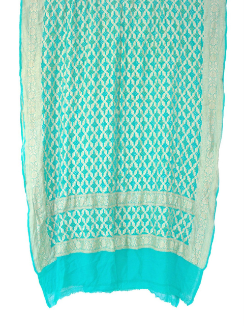 Turquoise Bandhani dupatta with patterned banarasi border and pallu by CHAKOR.
