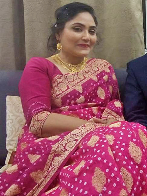 Dr. Ruby Ansari wearing a pink Bandhani saree from CHAKOR.
