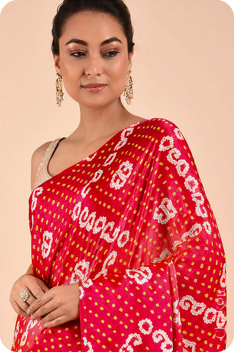 Chakor's traditional Red orange bandhani silk saree with mukaish embroidery