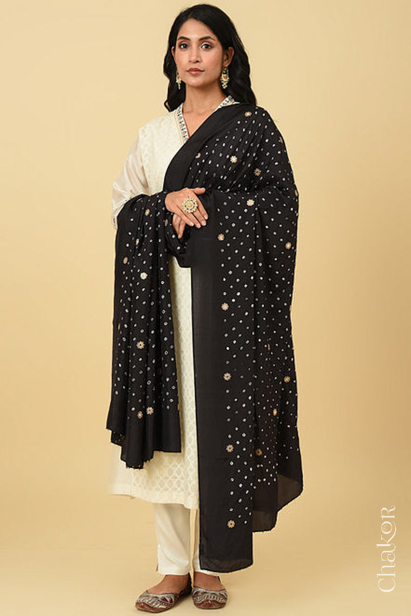 Full view model wearing Black Bandhani Mulberry silk dupatta with sequins embroidery and bead edging.