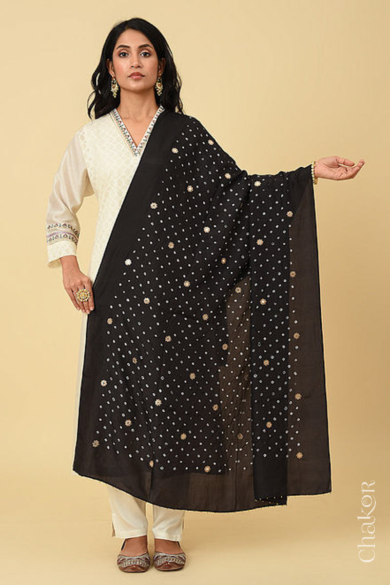 Full shot of model wearing Black Bandhani Mulberry silk dupatta with sequins embroidery and bead edging.