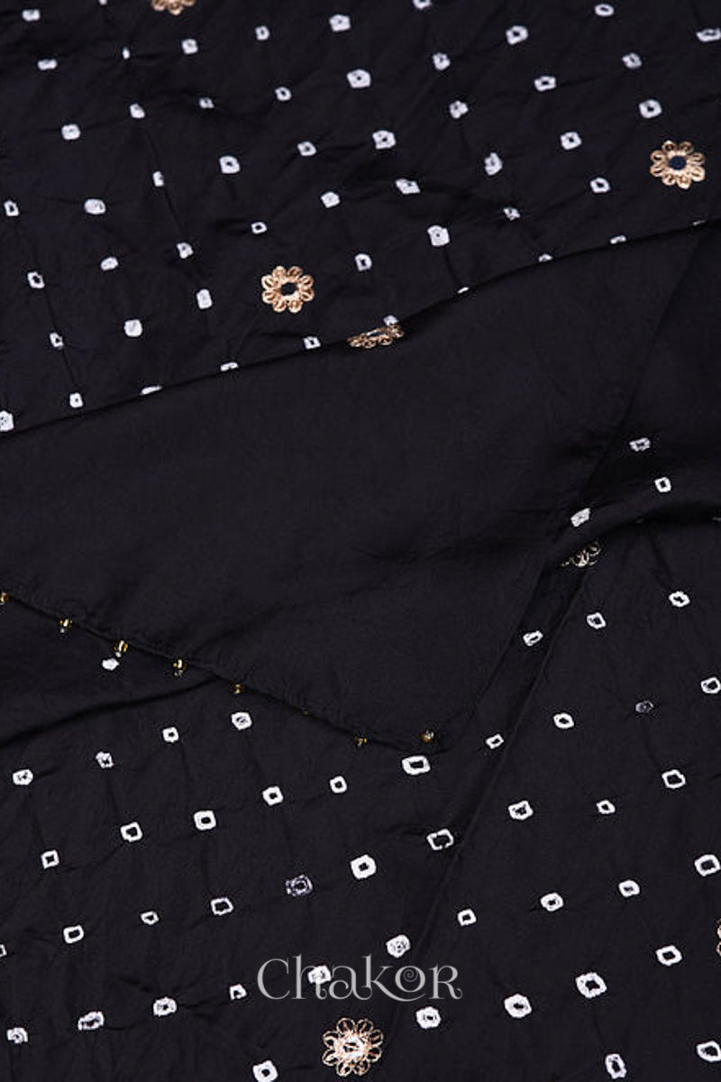 Close up of Black Bandhani Mulberry silk dupatta featuring sequins embroidery and bead edging.