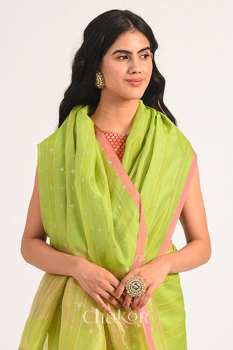 Model wearing Lime Green Chanderi Silk Cotton Saree with zari embroidery.