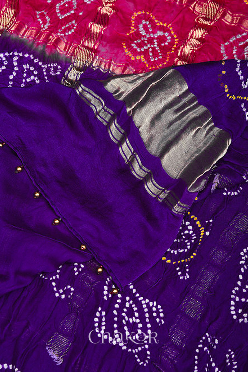 Close up of Pink Purple Bandhani Gharchola Gaji Silk Dupatta  featuring zari check and beads edging on pallu.