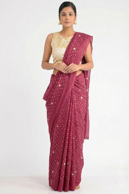 Woman wearing Dusty Red Bandhani Mulberry Pure Silk Saree, with handcrafted rai bandhej patterns using traditional tie-dye techniques from Kutch.