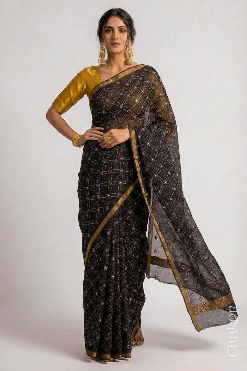 Model wearing Black bandhani pure georgette silk saree with mirror embroidery.