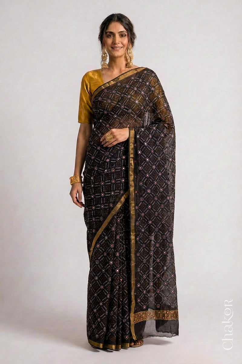 Model wearing Black bandhani pure georgette silk saree with mirror embroidery.