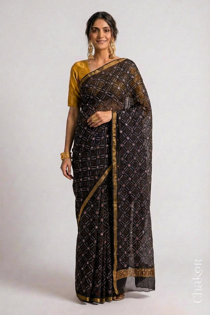 Model wearing Black bandhani pure georgette silk saree with mirror embroidery.