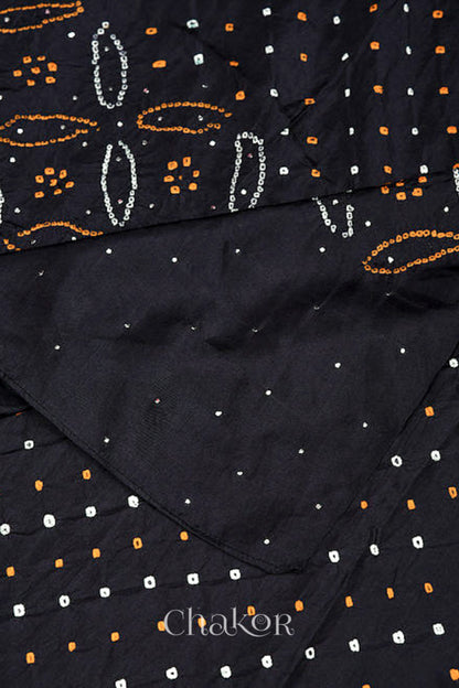 Close up of black Bandhani mulberry silk dupatta with multi colour tie-dye dot pattern & detailed with mukaish work &  Bead edging.