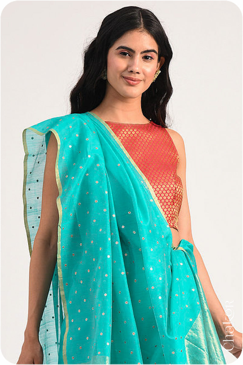 Chakor's Peacock Blue Handloom Silk Cotton Saree with woven tissue pallu & delicate sequin work buttis.