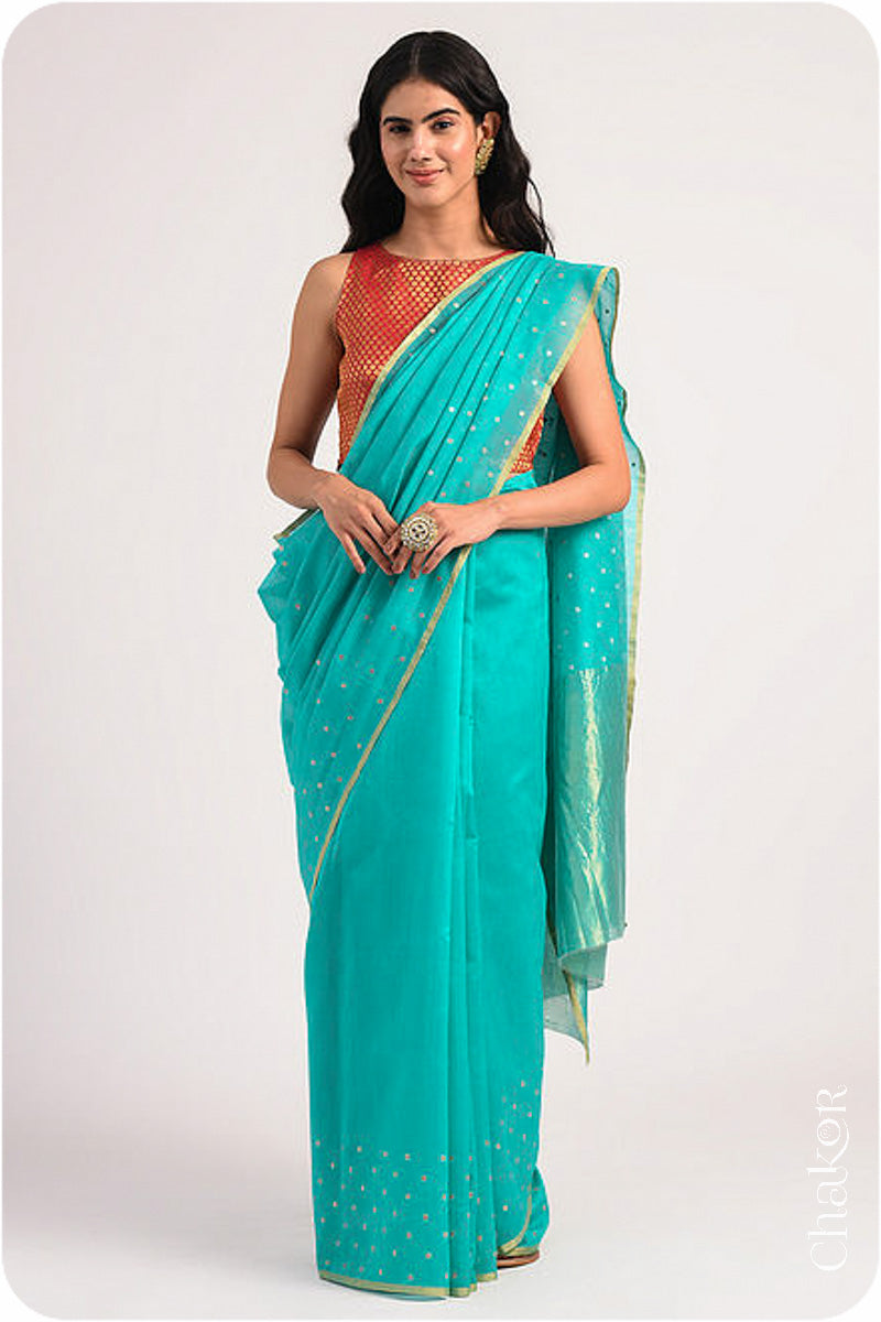 Chakor's Peacock Blue Handloom Silk Cotton Saree with woven tissue pallu & delicate sequin work buttis.