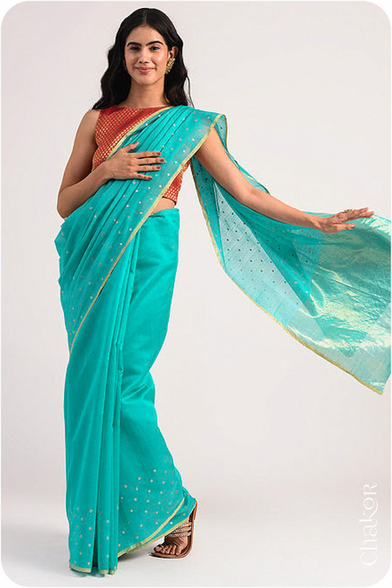 Chakor's Peacock Blue Handloom Silk Cotton Saree with woven tissue pallu & delicate sequin work buttis.