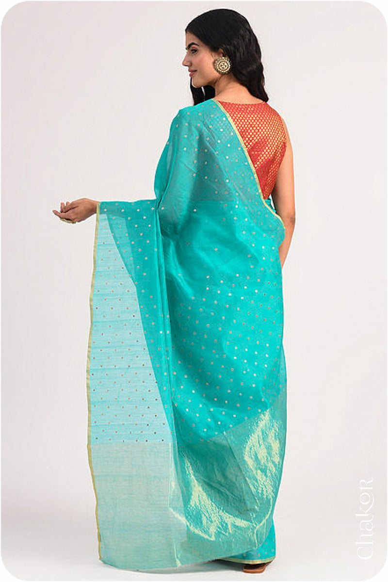 Chakor's Peacock Blue Handloom Silk Cotton Saree with woven tissue pallu & delicate sequin work buttis.