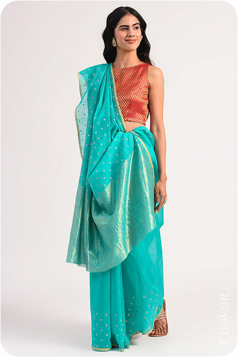 Chakor's Peacock Blue Handloom Silk Cotton Saree with woven tissue pallu & delicate sequin work buttis.