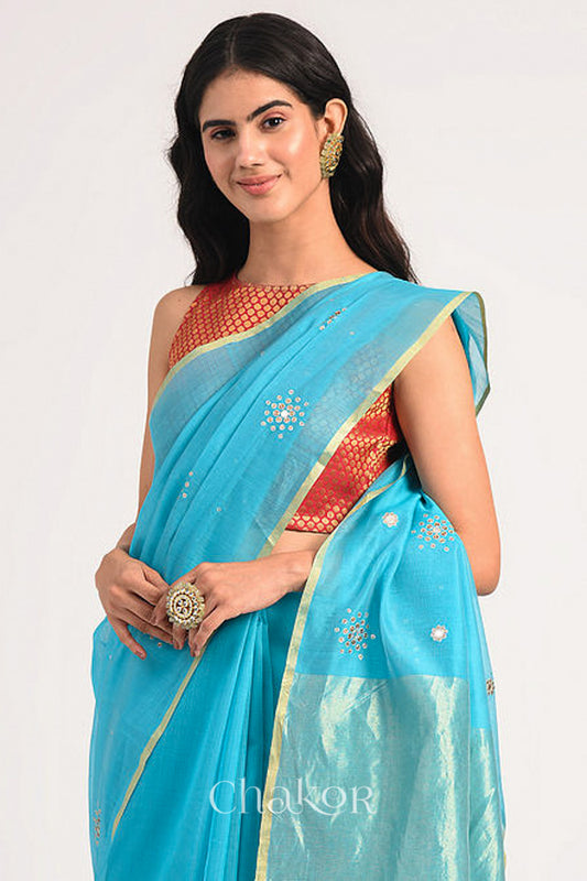 Chakor's Peacock Blue Handloom Silk Cotton Saree with woven tissue pallu & delicate sequin work buttis.