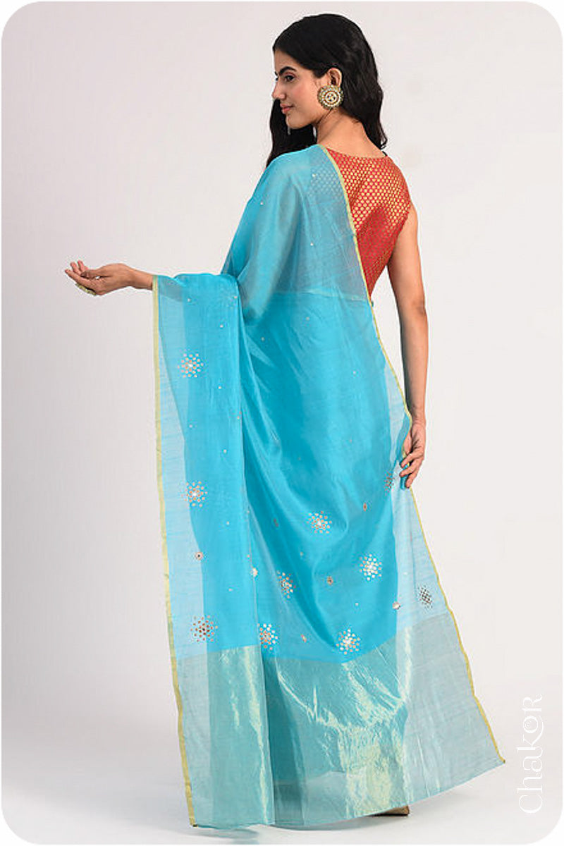 Chakor's Peacock Blue Handloom Silk Cotton Saree with woven tissue pallu & delicate sequin work buttis.