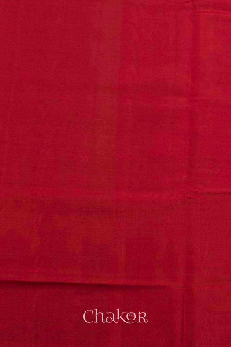 Blouse material of Handloom Orange Rajkoti Patola Ikat Mulberry Silk Saree with red borders pallu, woven using traditional designs in Gujarat.