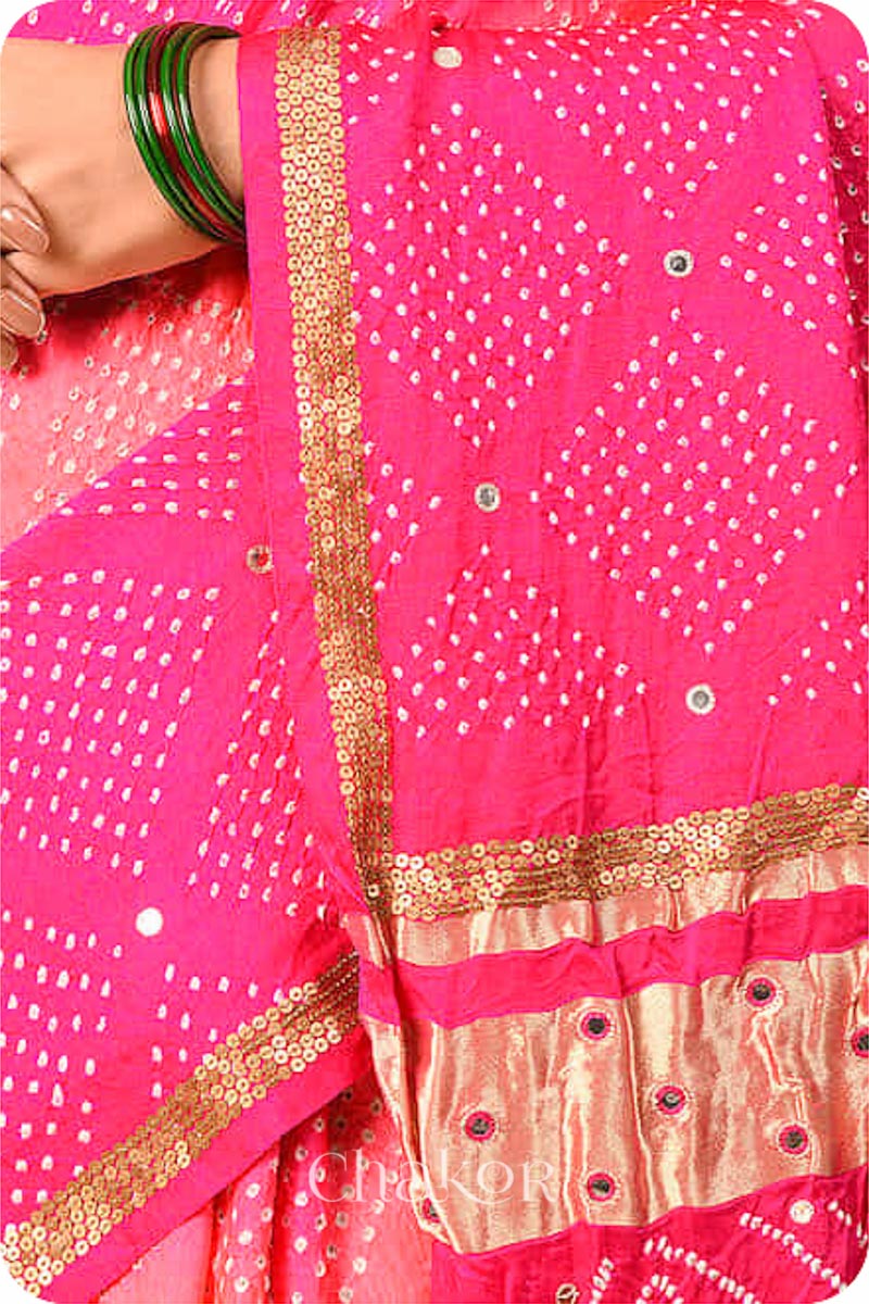 Chakor's traditional Peach Pink bandhani pure silk saree with sequins embroidery.