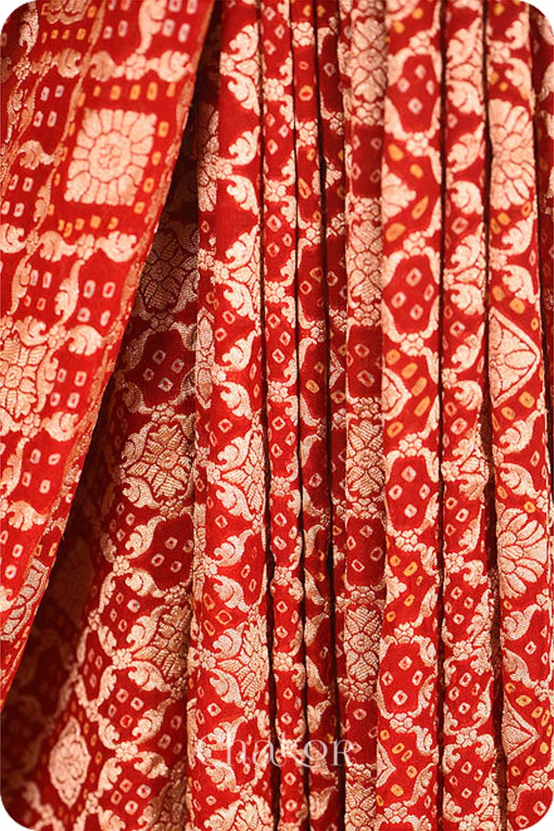 Chakor's traditional Red bandhej banarasi silk handloom saree.