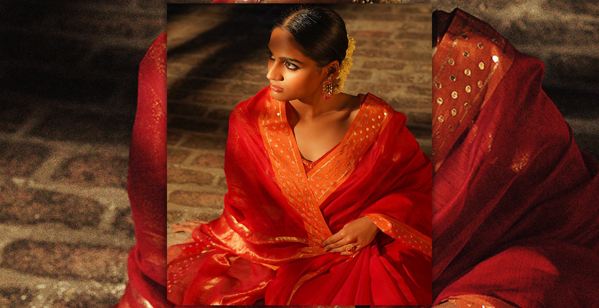 Beautiful woman dress in silk cotton Chanderi Red Saree having orange border embroidered with sequins.