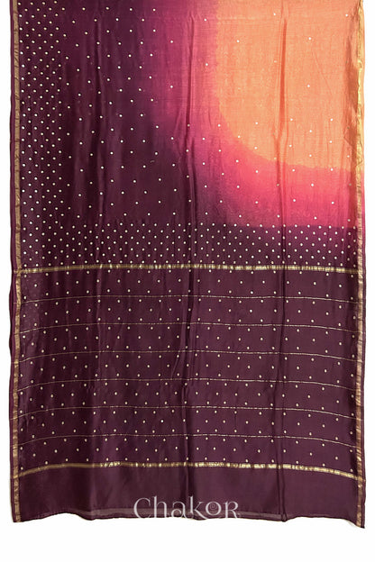 Flat view of peach maroon shaded Chanderi silk cotton saree showing ombre transition and border finish.
