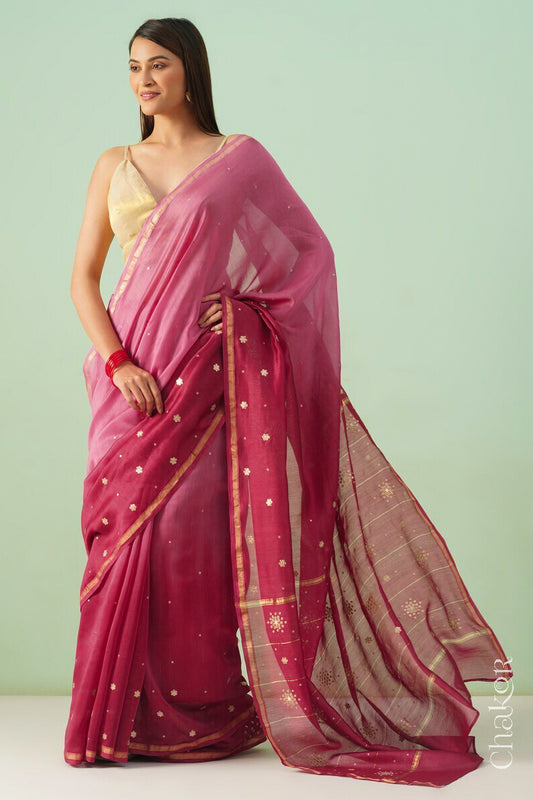 Model wearing a pink plum shaded Chanderi silk cotton saree with hand-embroidered sequin and zari details.
