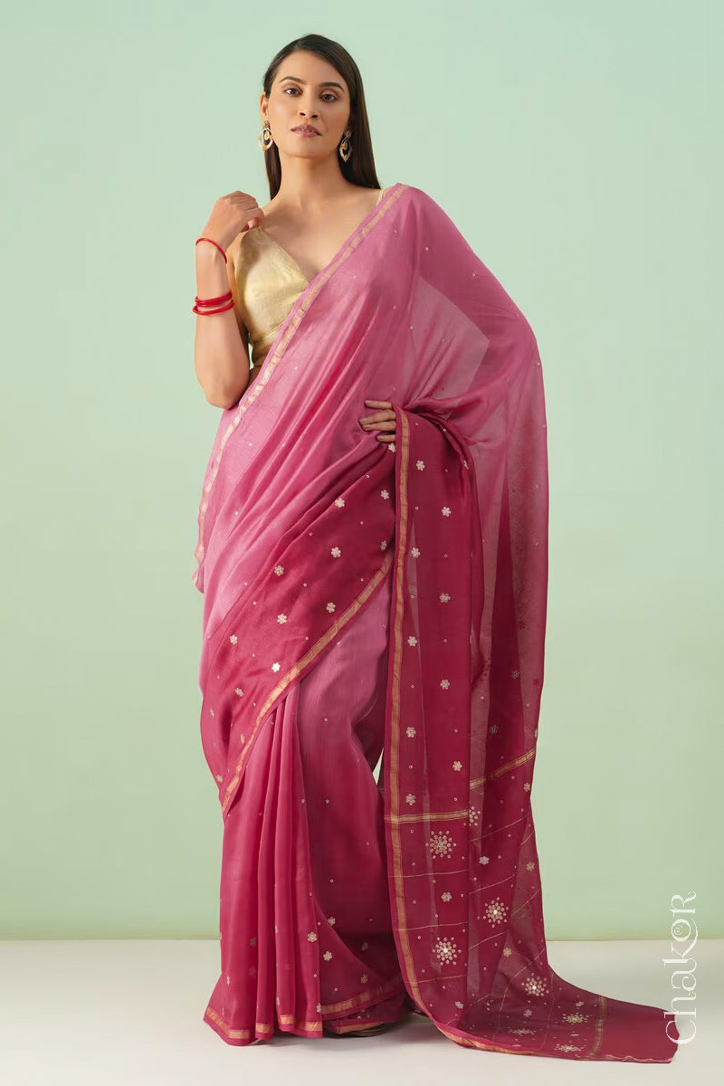 Full-length view of pink plum shaded Chanderi silk cotton saree with ombre effect and tissue-striped pallu.
