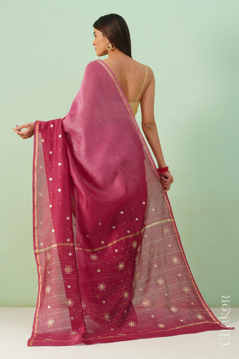 Back view of pink plum shaded Chanderi silk cotton saree displaying ombre dyeing and tissue pallu.
