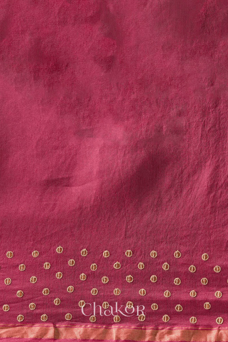 Detail of unstitched blouse piece and scattered sequin embroidery on pink plum Chanderi silk cotton saree.
